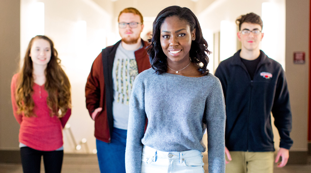 A group of La Roche University students standing in front of the main steps in the Zappala Campus Center.